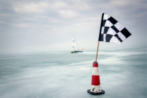 Ice sailing European championship on the Balaton / Balaton in Hungary, the orange regatta brand and the limit banner featuring the regatta track Ice sailing European championship on the Balaton / Balaton in Hungary, the orange regatta brand and the limit banner featuring the regatta track